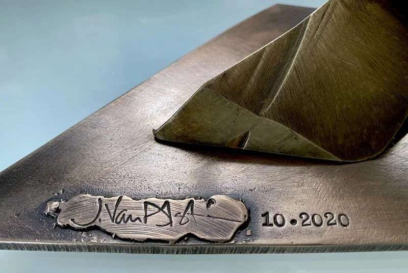 800PyxisAwry_bronze-wave_sign.jpg