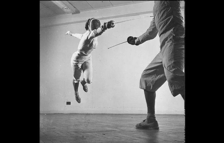 also:  in the sport of Fencing : defined as a running attack with arm extended