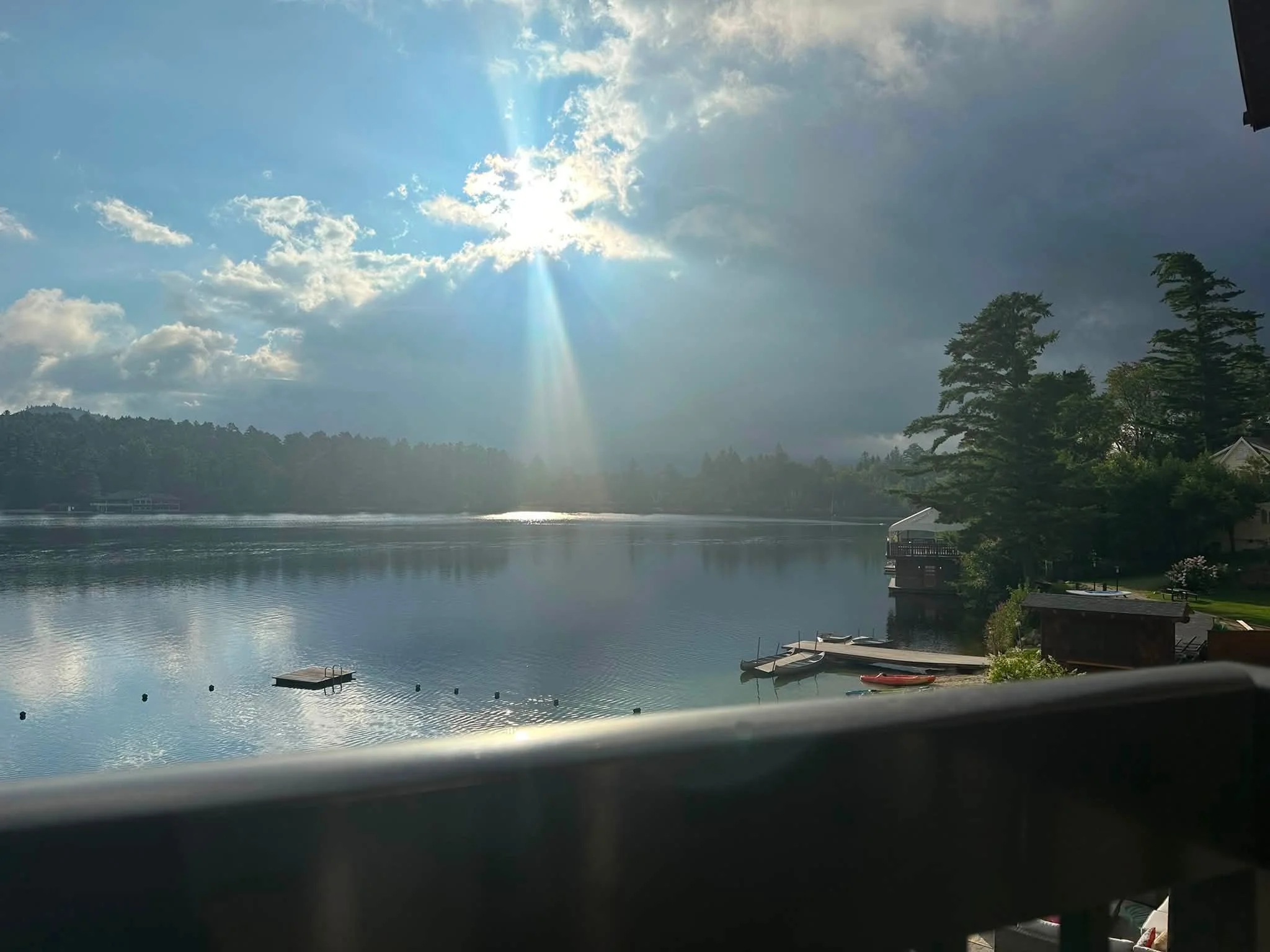 Visiting Lake Placid staying on Mirror Lake, woke up to some beautiful skies, sun and cloud activity.
