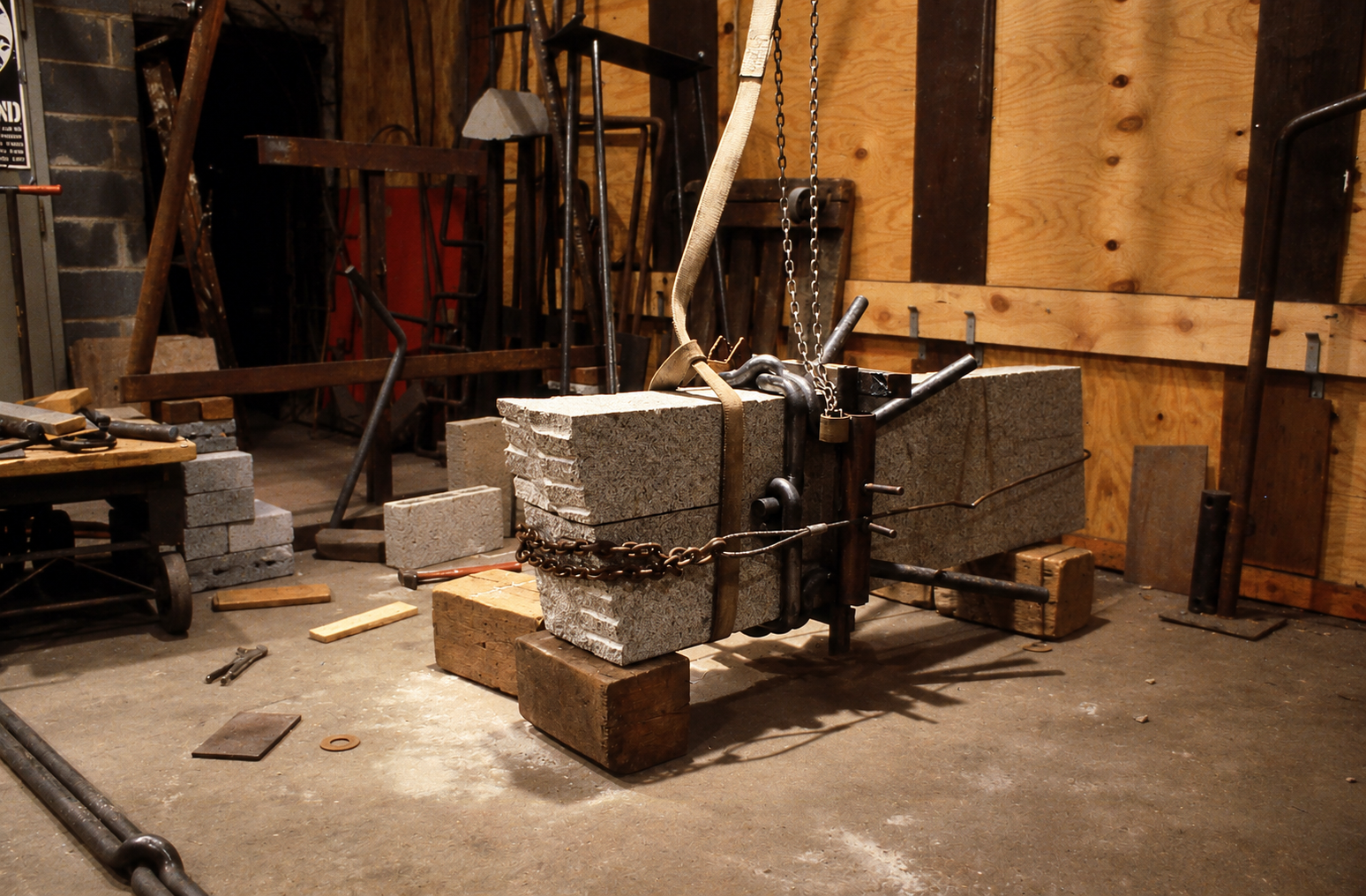 "wrapping" forged steel around granite wedge during fabrication - DC studio at 57 N Street NW