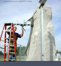 Artist marking sun angle during construction