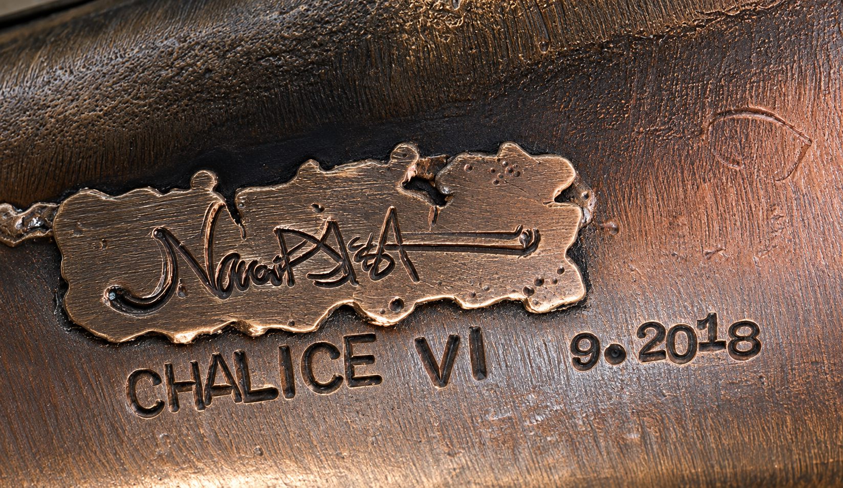 title and signature on bronze base