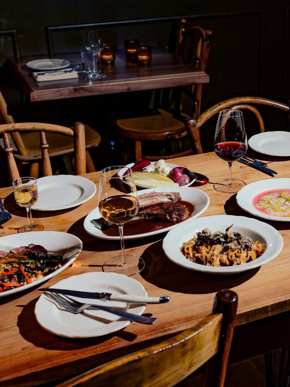 &ldquo;Every inch of Somssi is charming: the lace curtains, the vintage baking tins repurposed as wall sconces, the plant-store potted greenery, the mismatched wooden chairs clustered around mismatched wooden tables. It&rsquo;s the kind of charm that