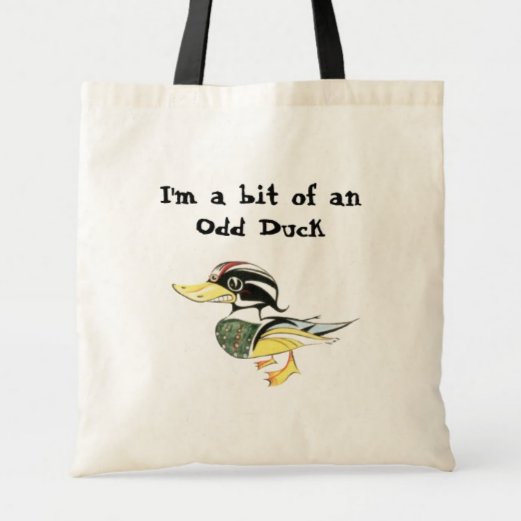 Cream-colored tote bag with black handles featuring the text "I'm a bit of an odd duck" and an illustration of a duck with colorful, patterned feathers.