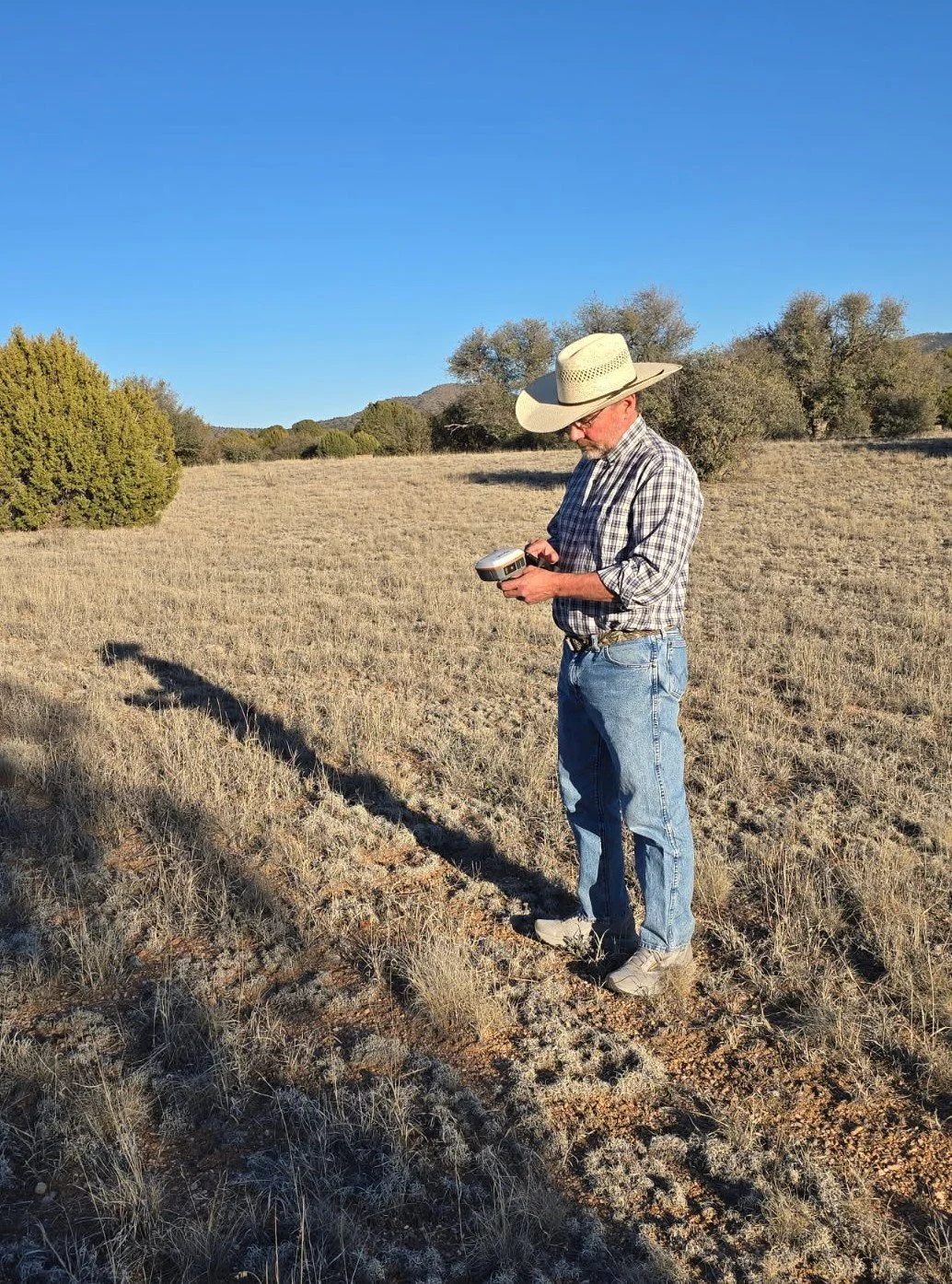 Rio Verde Archaeological Services owner John Rose recording an archaeological site using a Juniper Geode sub-meter GPS receiver.