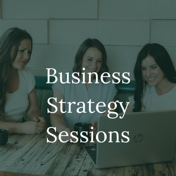 Business coaching session with consultants and creative entrepreneur. Three women sitting around a wooden table, looking at a laptop, with a text overlay reading 'Business Strategy Sessions'.