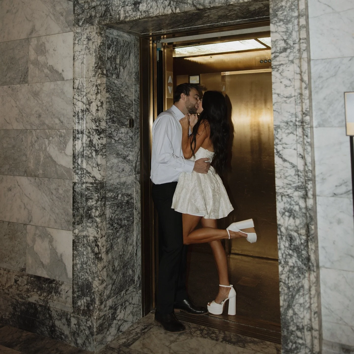 Image of a couple featuring a perfect spray tan on the female partner