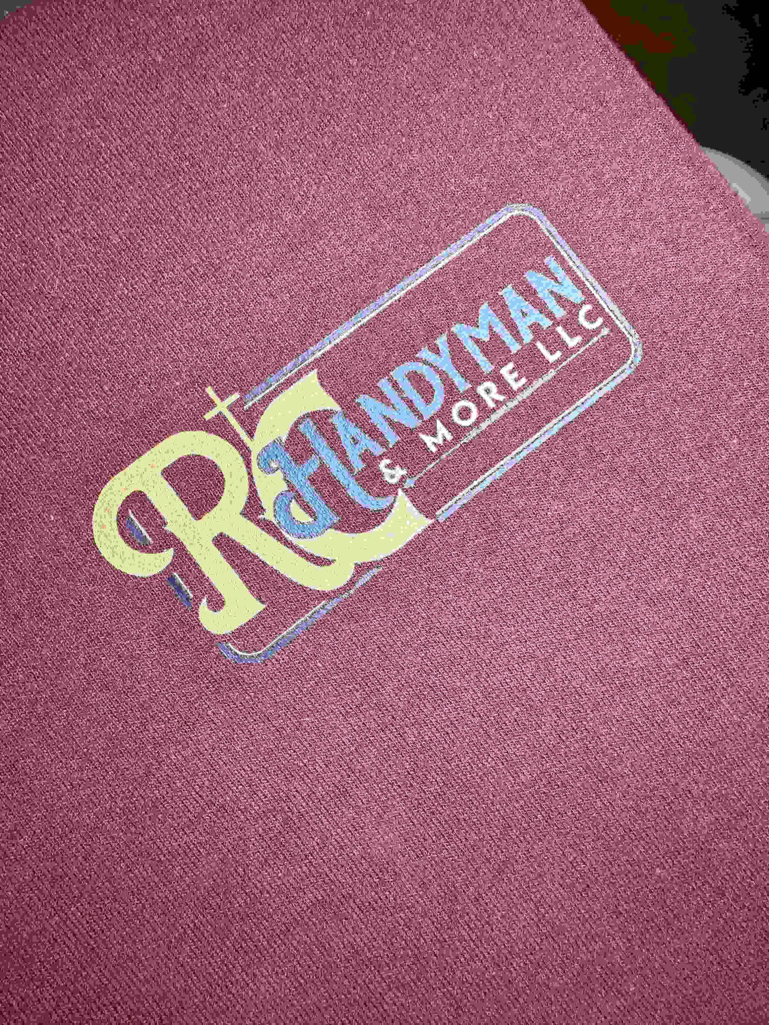 Custom business logo on a red t-shirt. 