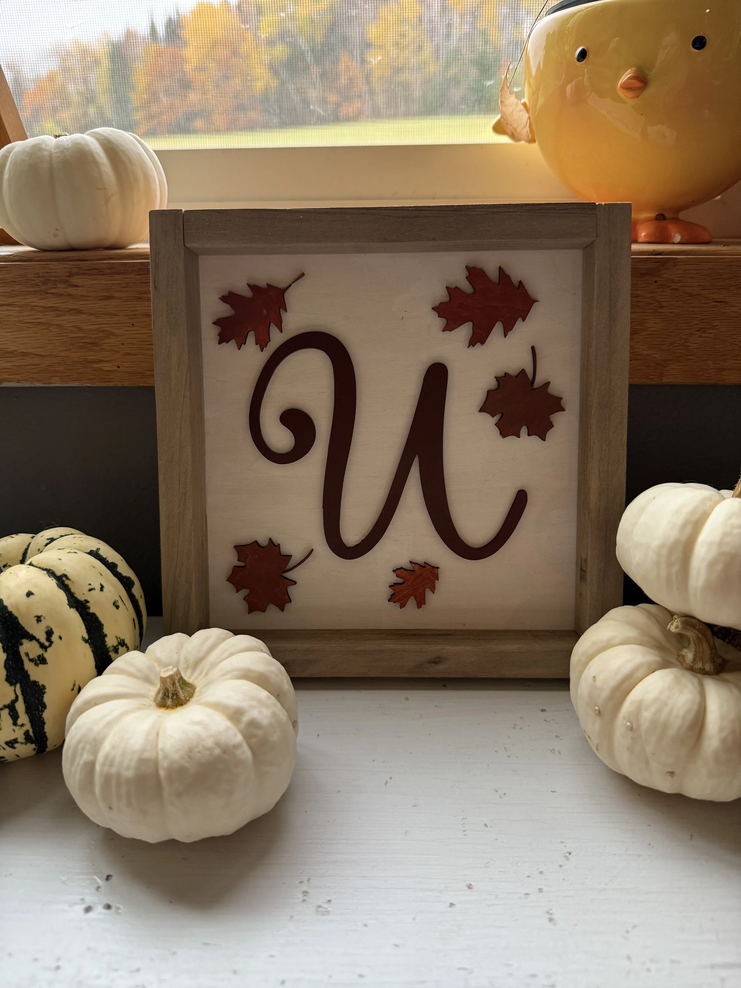 5x5 custom initial sign, hand-painted with additional leaves. Includes a weathered frame. 