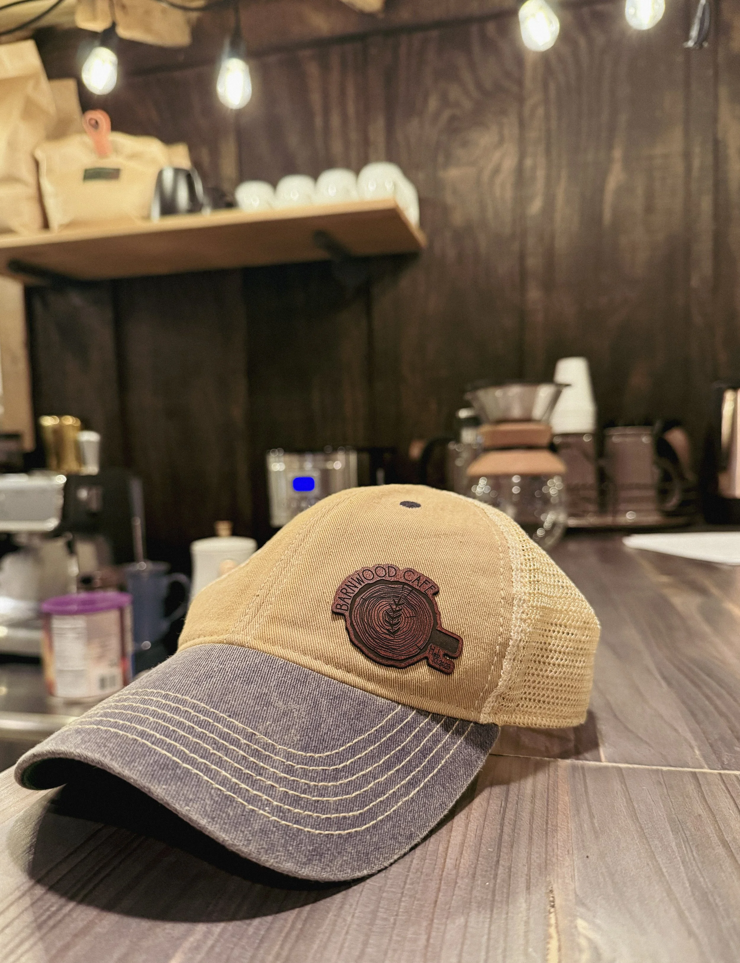Tan and navy ball cap with rustic brown, laser engraved patch- made for the Barnwood Cafe. 