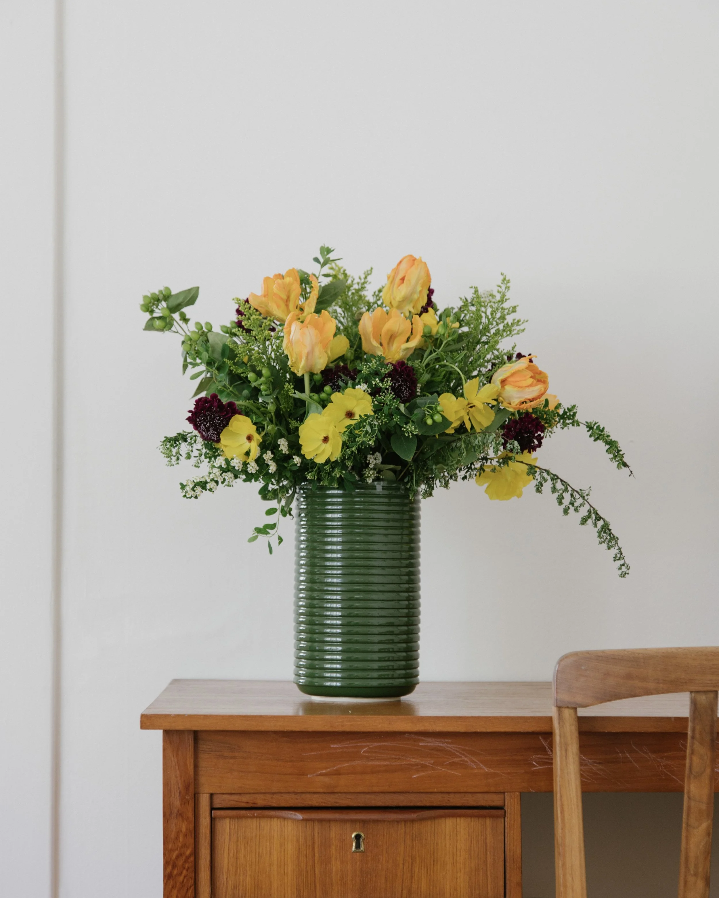 Corrugated vase featuring an arrangement for my wedding by Grasslands Flower Co. - 2022