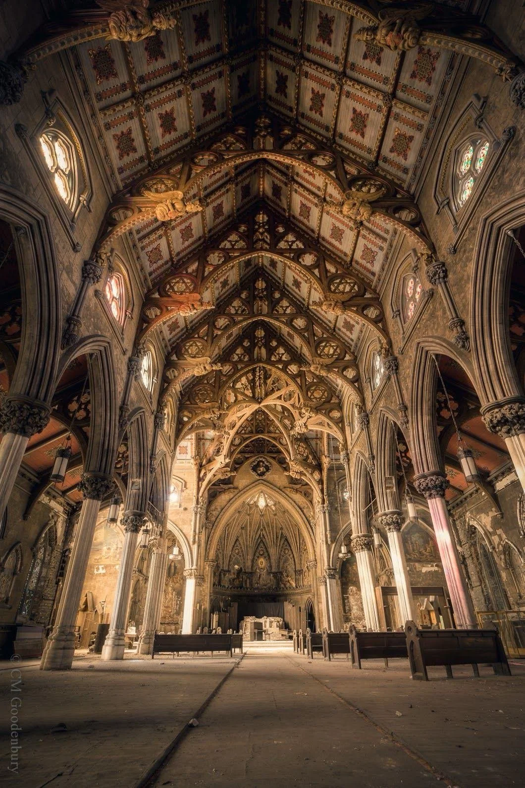 Inside St. Joseph's Church, a grand, ornate Gothic-style cathedral with high vaulted ceilings, decorative arches, detailed woodwork, and stained glass windows.