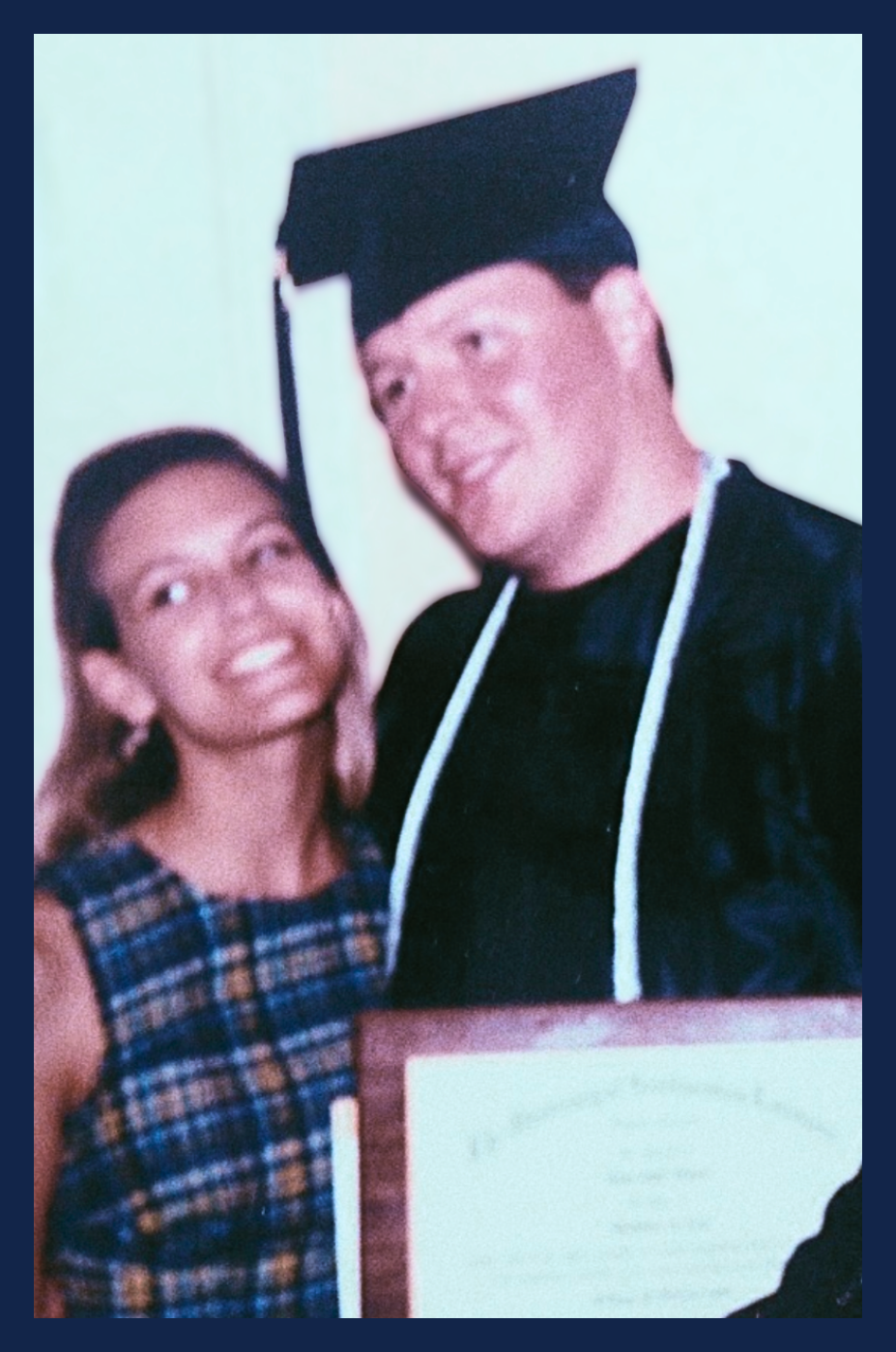 University of Southwestern Louisiana / U.S.L. ( now University of Louisiana / U.L.) graduation day 1999. Bart Hebert for City Court Judge in cap and gown, holding diploma alongside his wife, Carrie Hebert.