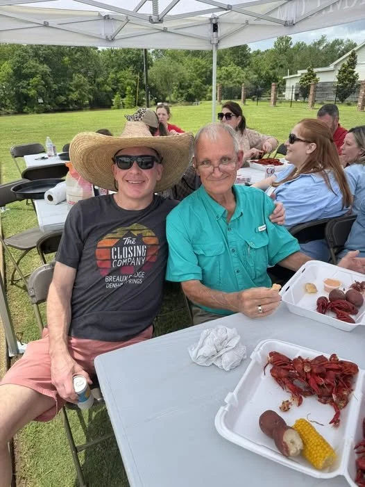 Bart Hebert for City Court Judge and his father at a crawfish boil on a sunny day.