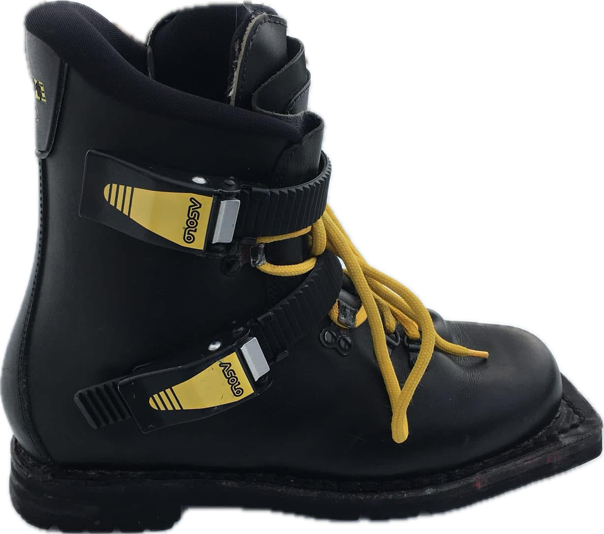 A black ski boot with yellow laces and two black straps with yellow and silver labels.
