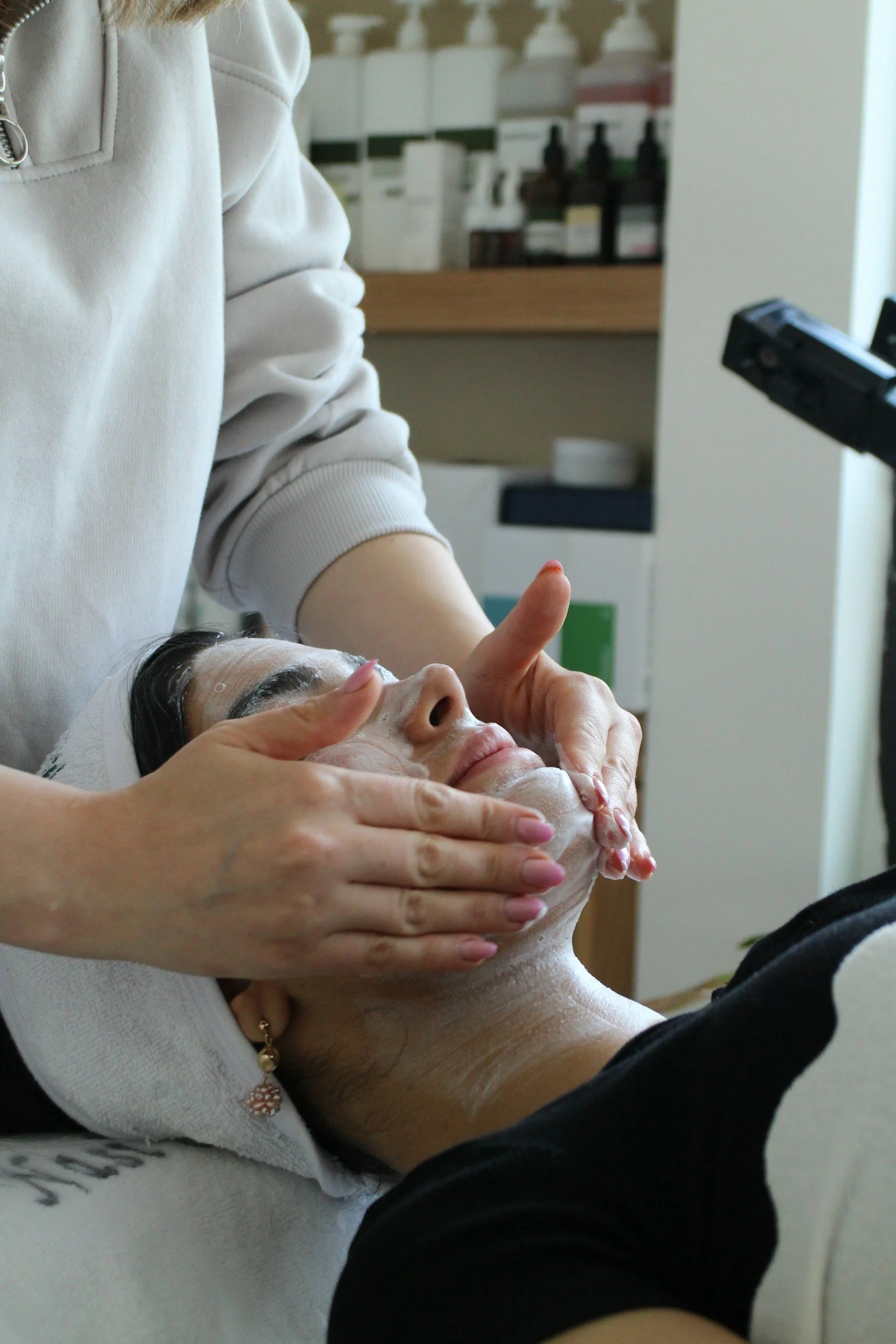 Client receiving a facial cleansing treatment at Soul Shine Skincare in Brownsburg.