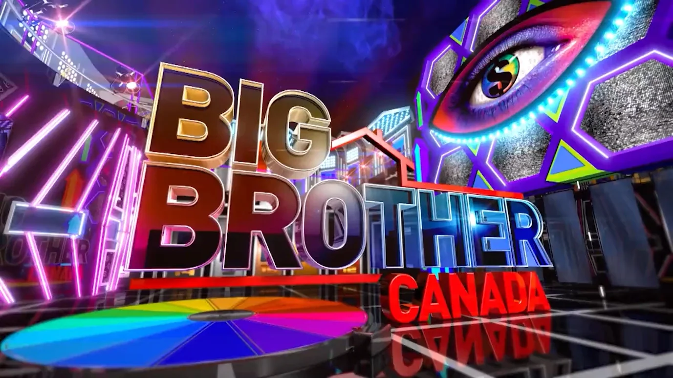 Bright neon lights and signs with the words 'BIG BROTHER CANADA,' a large eye, and colorful reflections suggest a lively television set or stage.