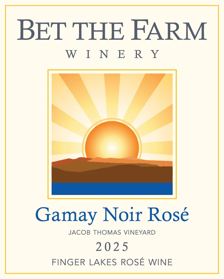 Wine label for Bet the Farm Winery featuring a sunset over hills and water, with text indicating Gamay Noir Rosé, Jacob Thomas Vineyard, 2025, Finger Lakes Rosé Wine.