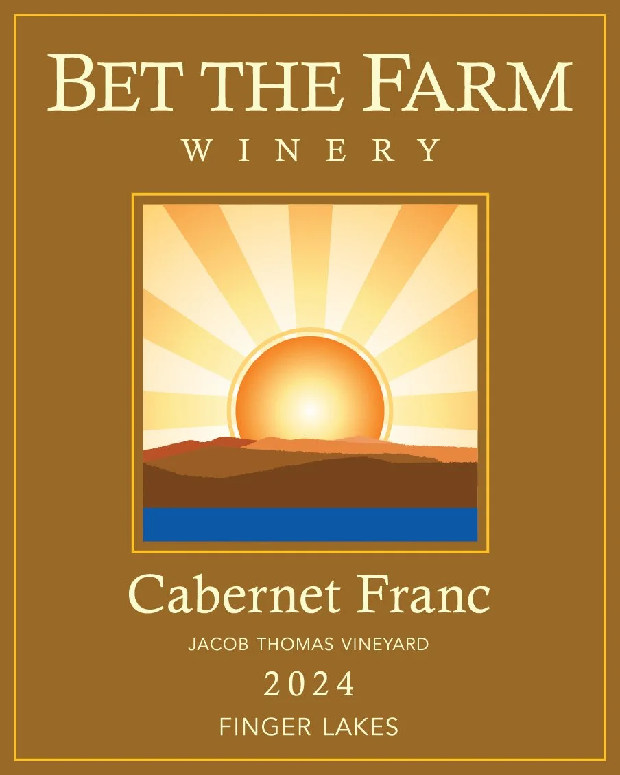 Wine label titled "Bet the Farm Winery" featuring a stylized sunset over a landscape with hills and a blue water body, and text "Cabernet Franc Jacob Thomas Vineyard 2024 Finger Lakes".