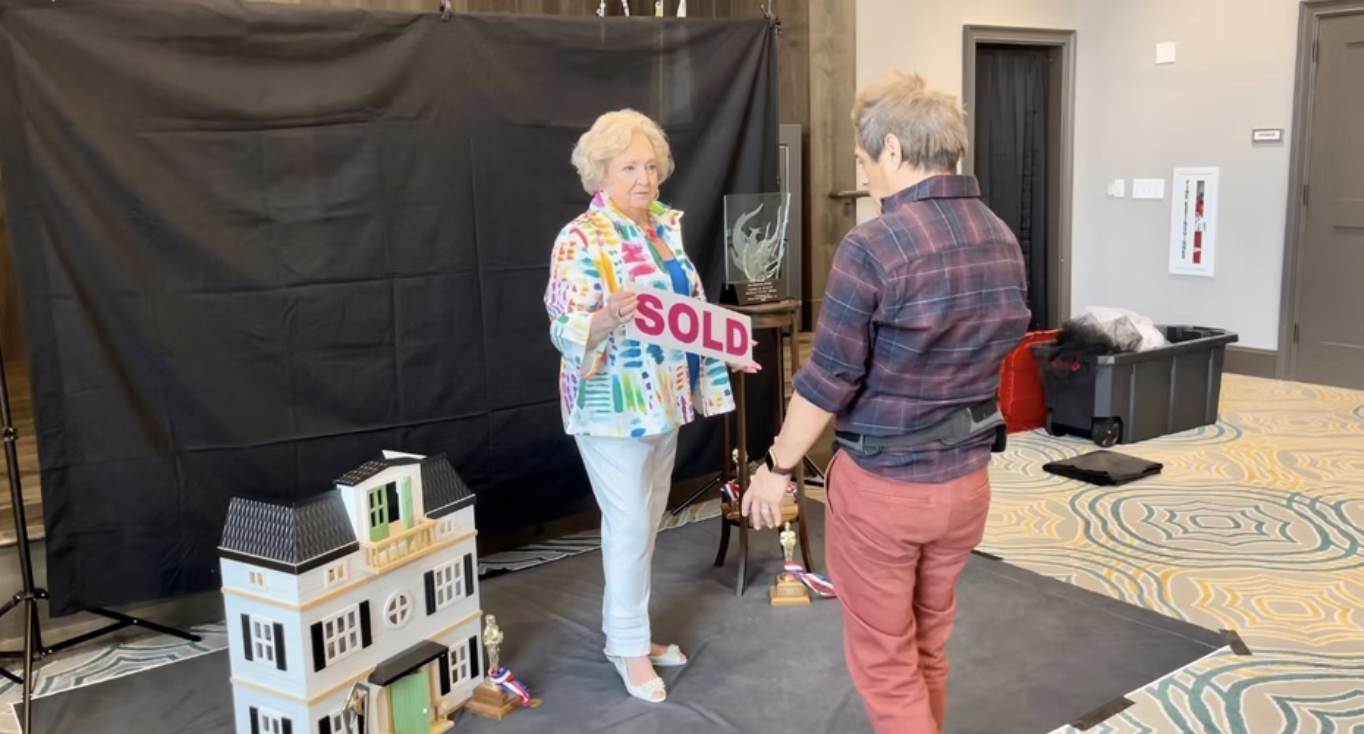 Carol and Saul staging the props for her portrait shoot.