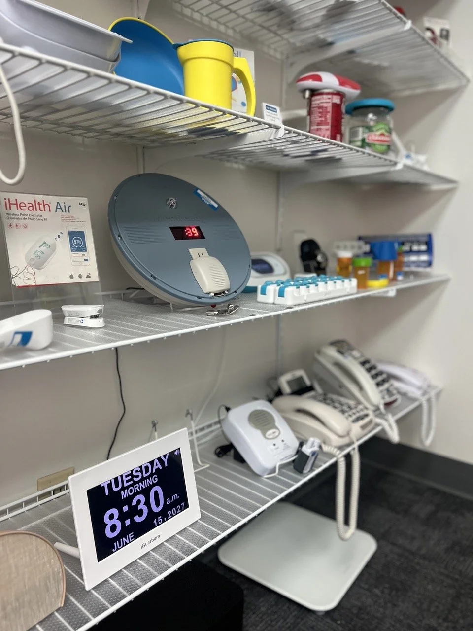 Variety of tools in the daily living area that include medication management and display clocks