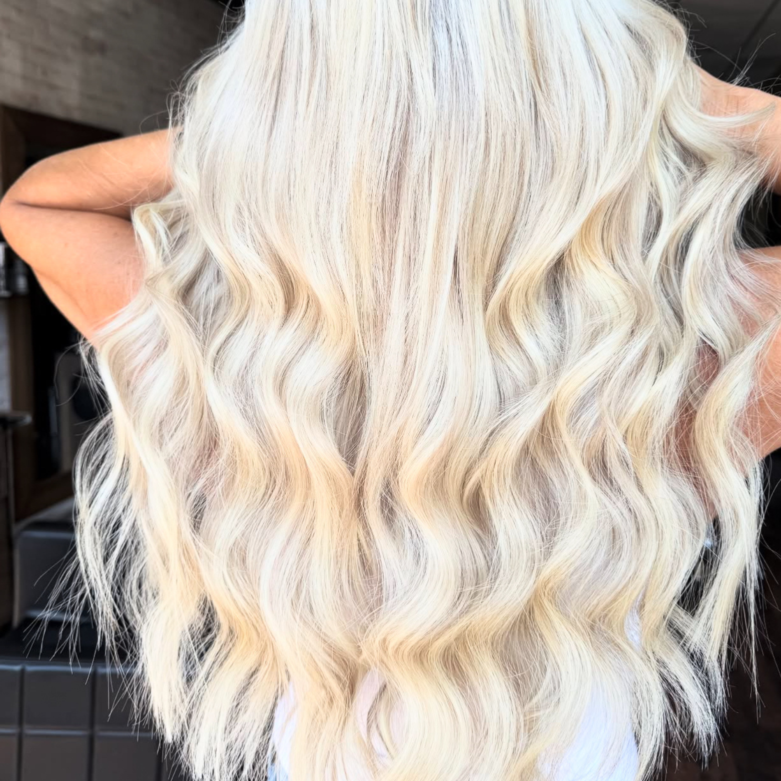 Long, wavy platinum blonde hair.
