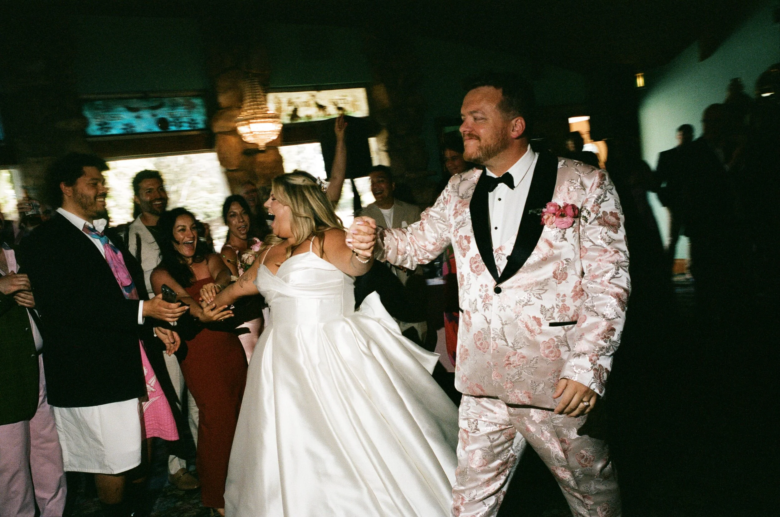 Laurie’s customers, Larissa and Emmett, just married walking off the aisle together.