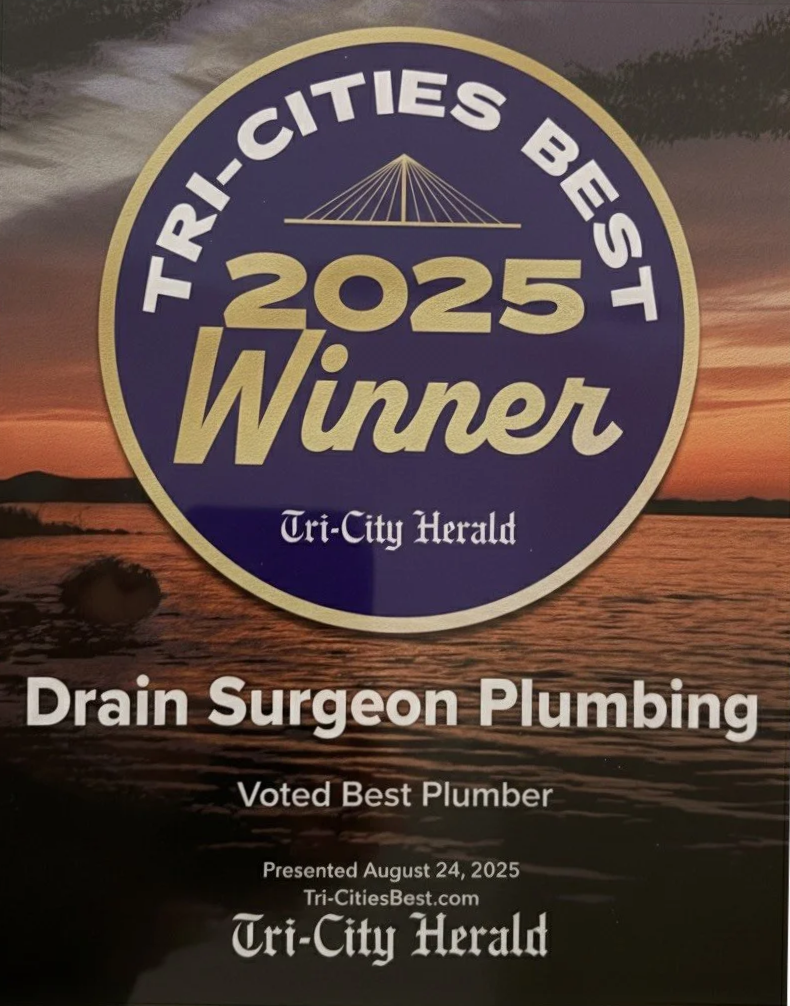 A badge recognizing Drain Surgeon Plumbing as the 2025 Tri-Cities Best Plumber, awarded by the Tri-City Herald on August 24, 2025, with a sunset over water in the background.