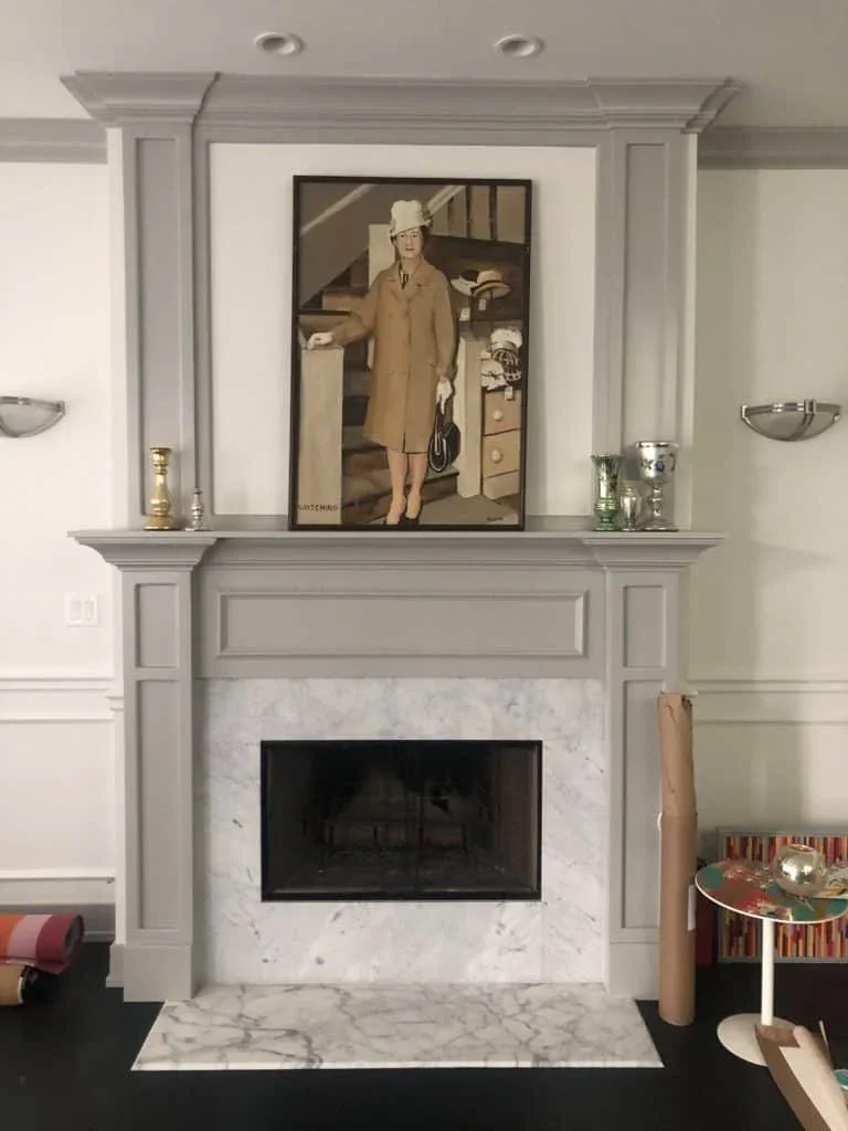 SW Pure White on walls and SW Dovetail on moulding and trim.