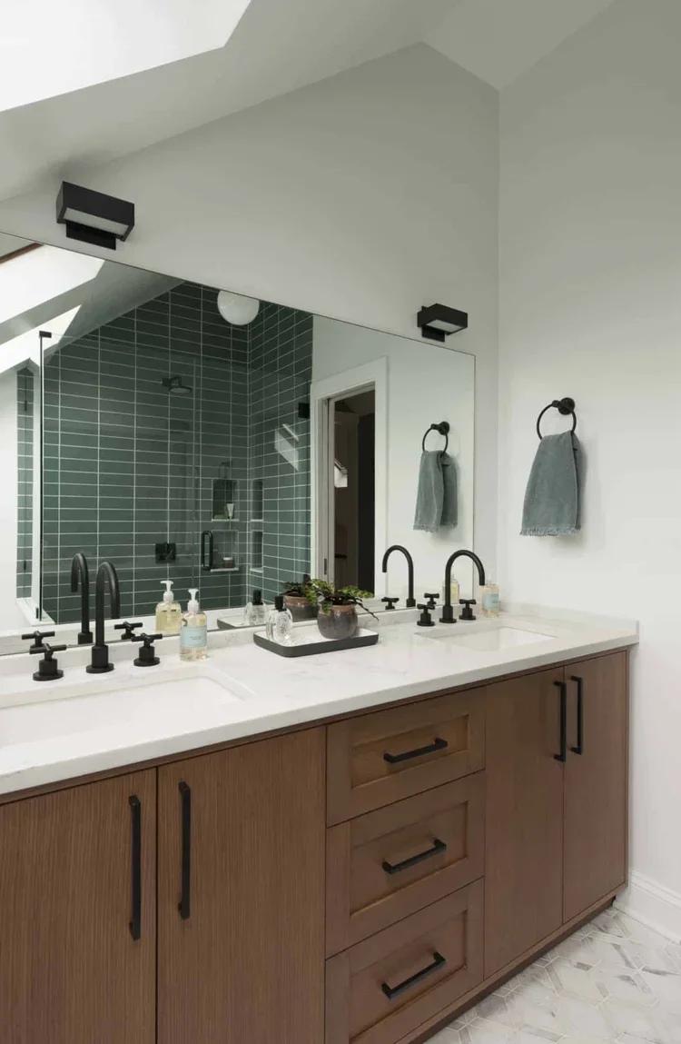 This is one of my favorite angles of the space because you can see how running the shower tile all the way up accentuates the dormered ceiling.