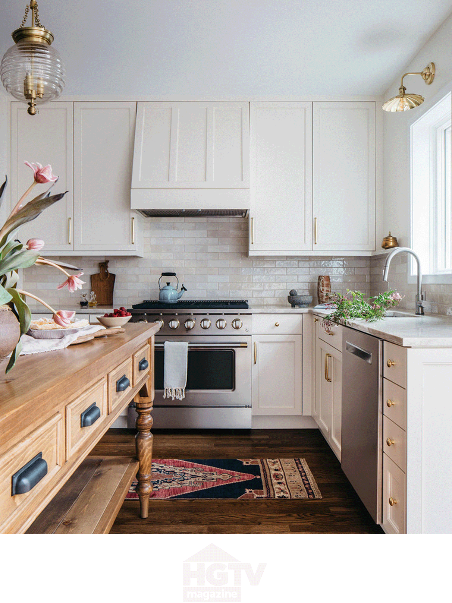 Modern kitchen with white cabinets, stainless steel stove, wooden island, and plants.