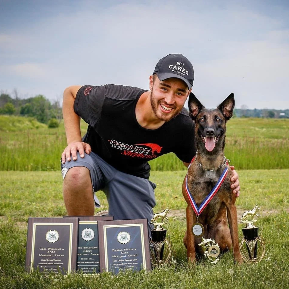 Trainer and Belgian Malinois after successful sport dog training in Ottawa.
