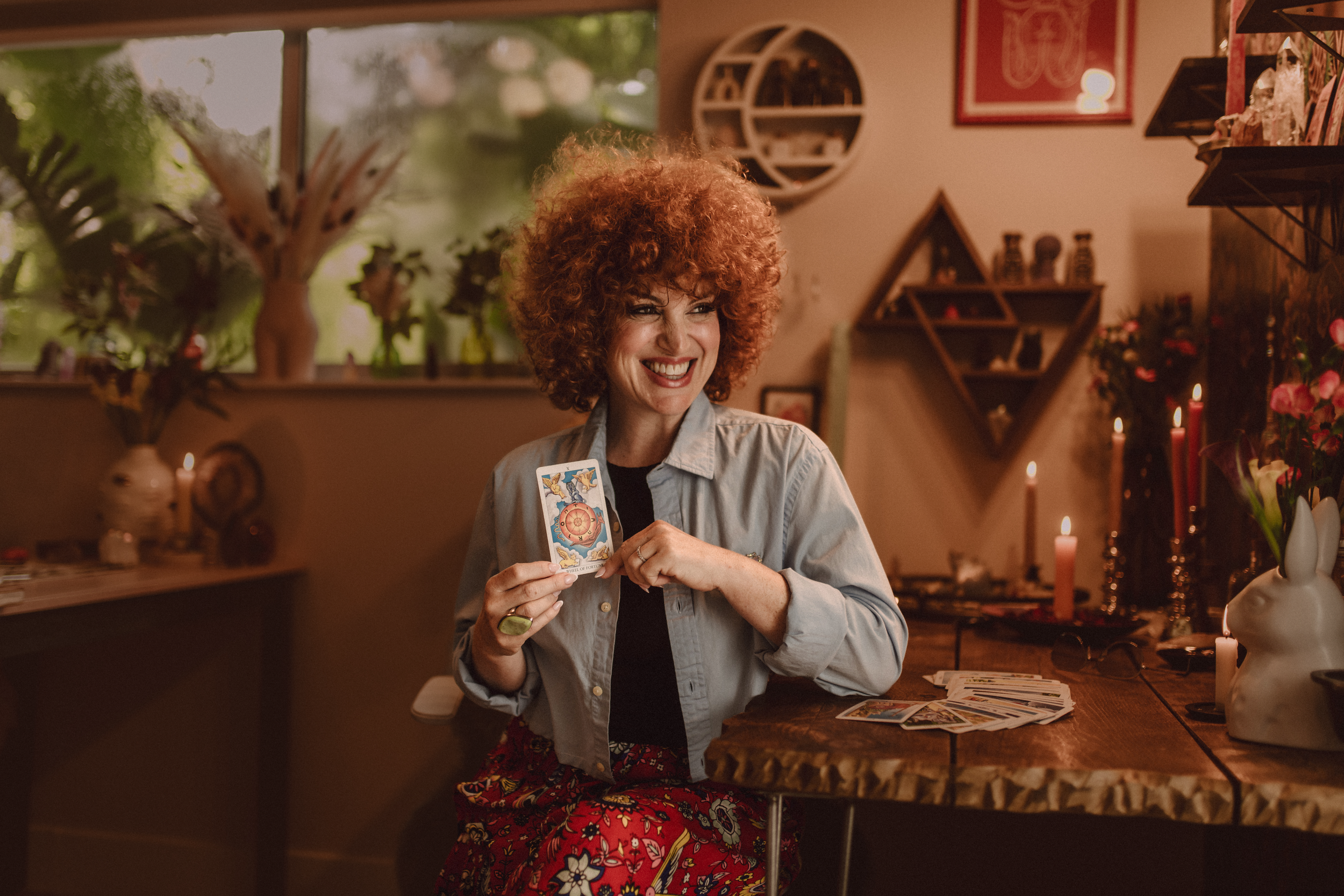 Dana Myers Holding Tarot Card