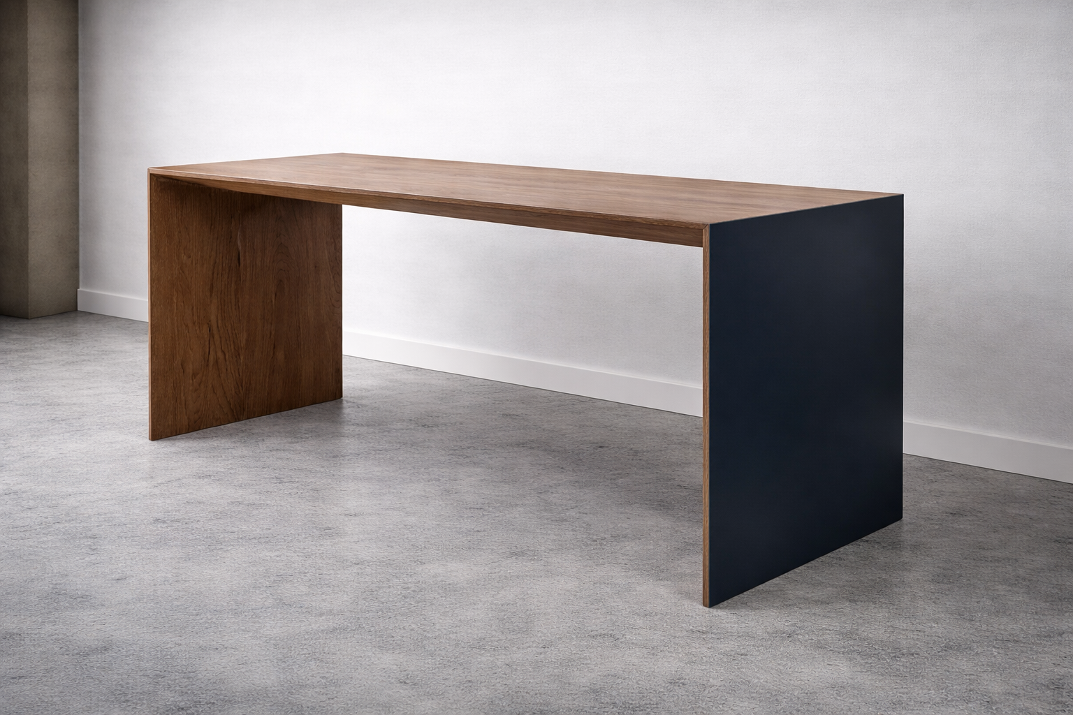 Modern wooden desk with a dark panel on one side in a minimalistic room.