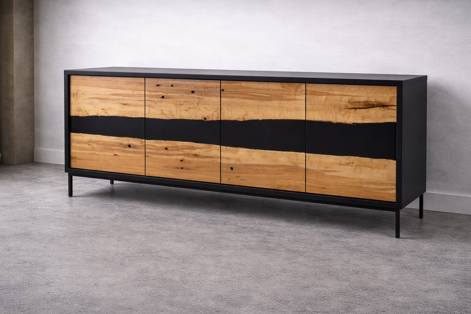 A modern black sideboard with four natural wood doors, featuring a black wavy stripe in the middle, standing on thin black legs against a plain white wall on a gray carpeted floor.