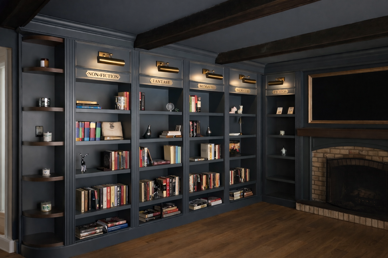 A dark blue built-in bookshelf with gold labels and lighting, filled with books and decorative items, next to a brick fireplace with a large black TV above it.