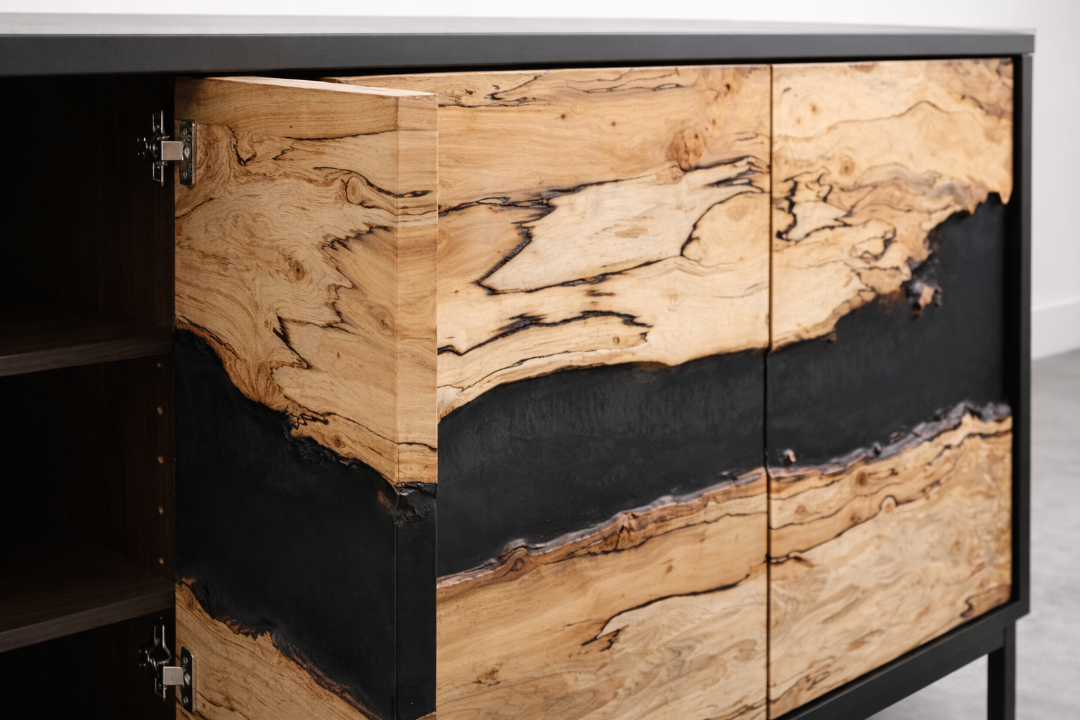 Close-up of a wooden cabinet with natural wood grain and black accents.