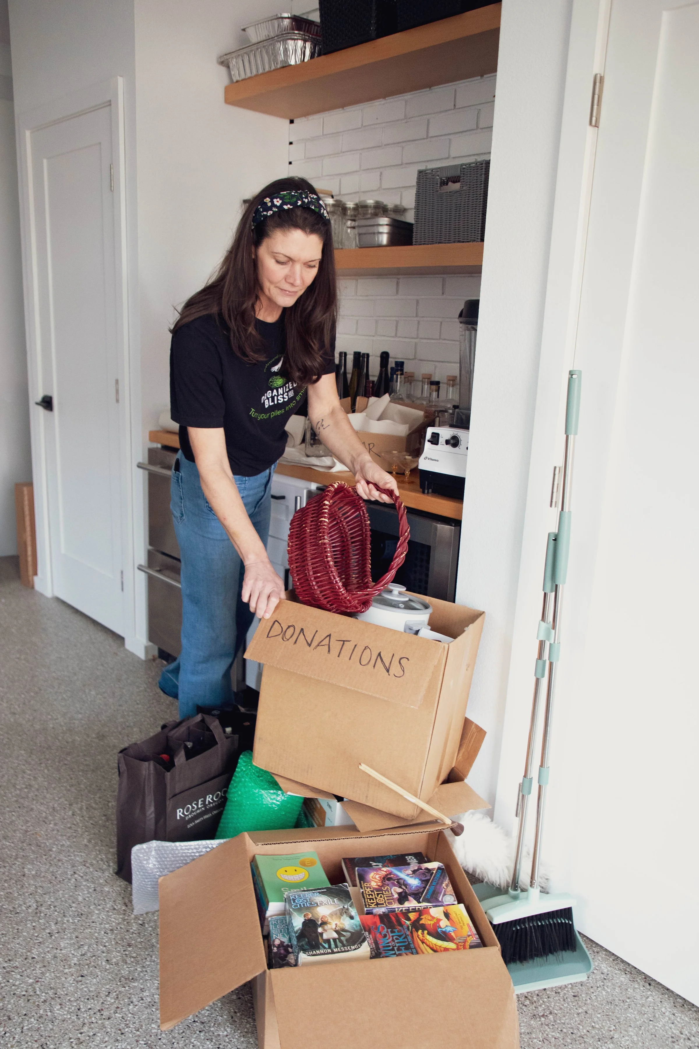 Empty wooden shelving unit with a small attached desk and a sliding door in the background.