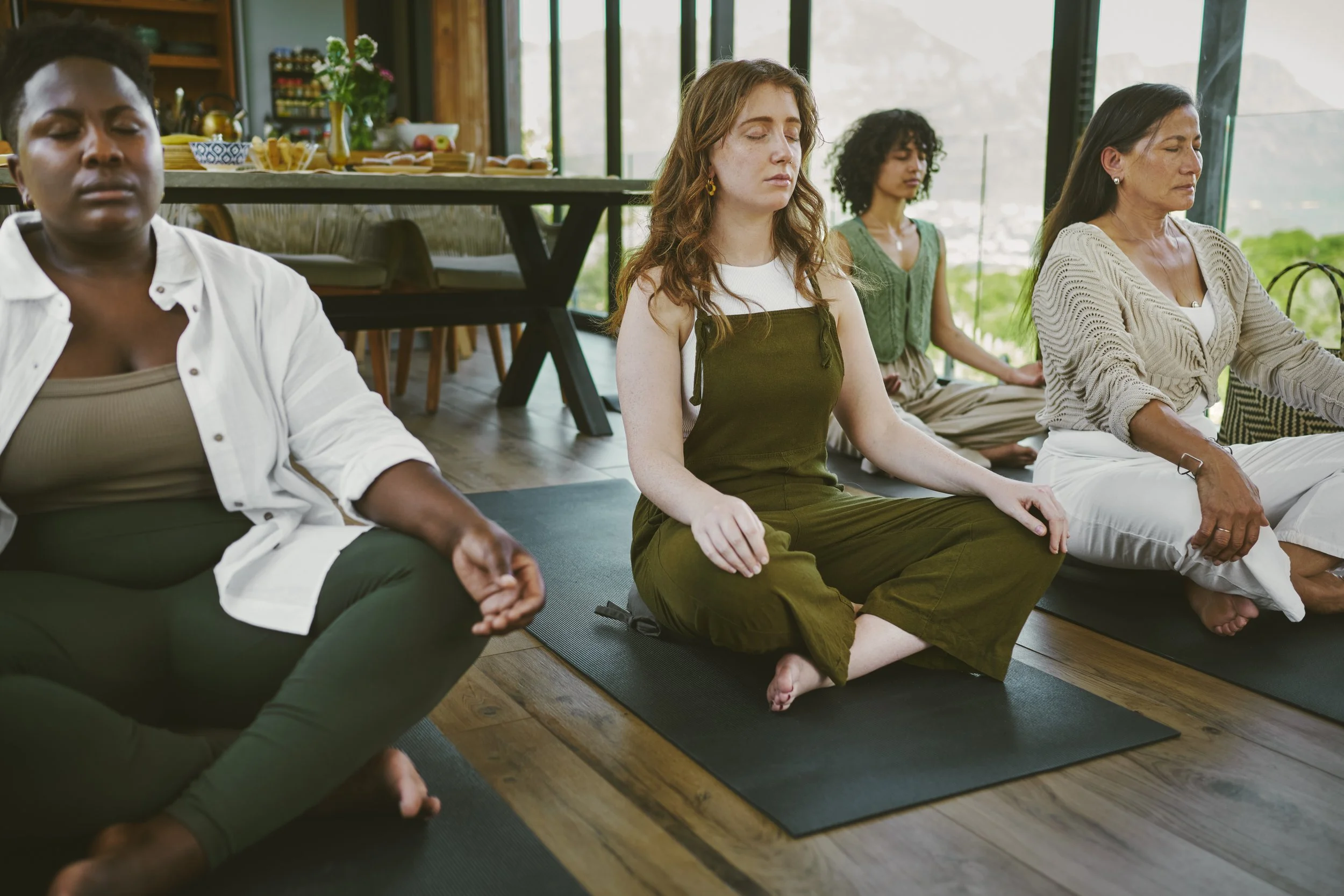 Women in group practicing strengthening emotional regulation, and moving toward more secure attachment using a gentle, nervous-system-informed approach.