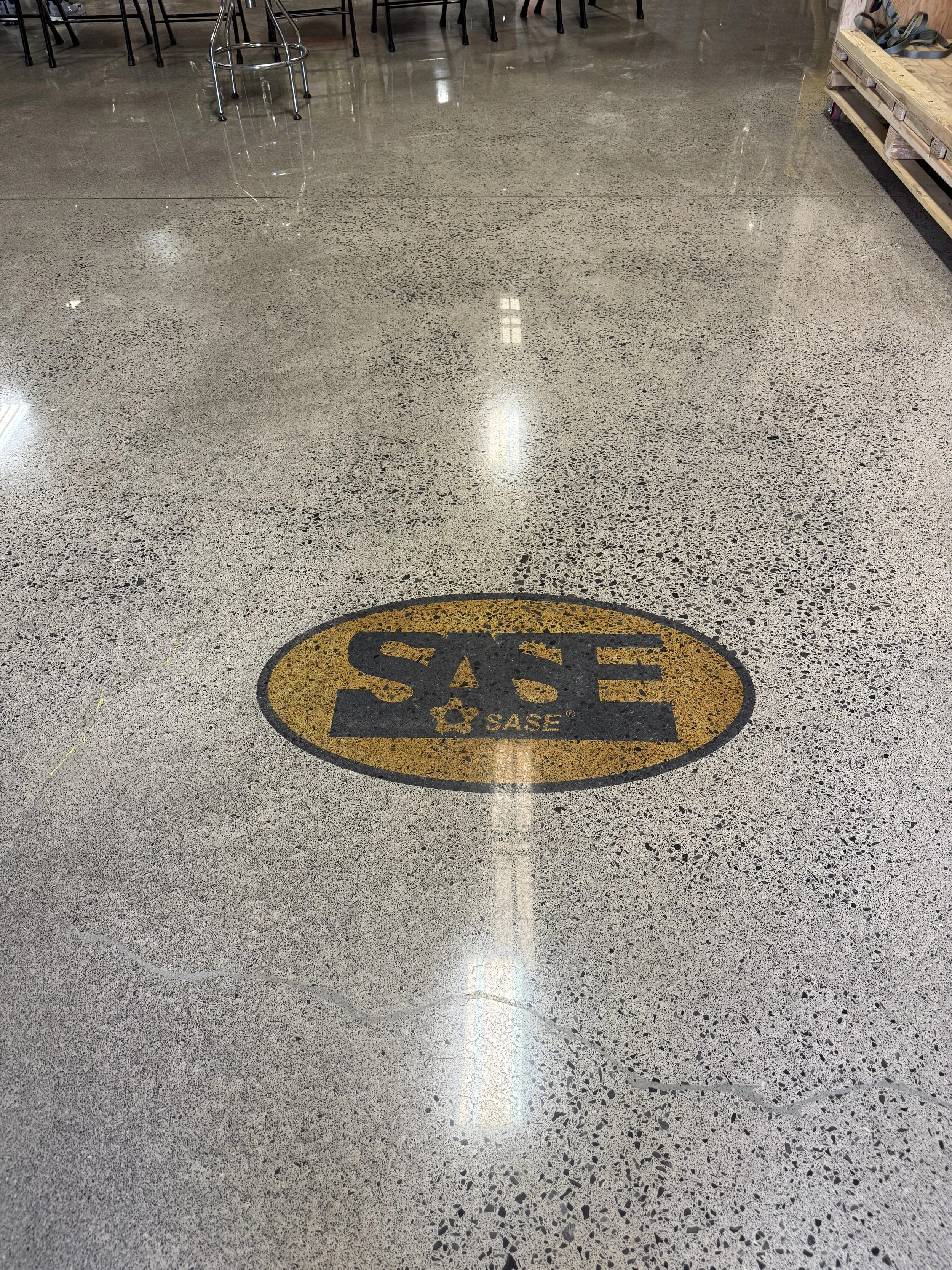 Dyed Polished Concrete Logo