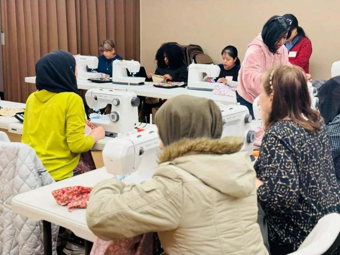 Refugees from differents countries coming together in this basic sewing program