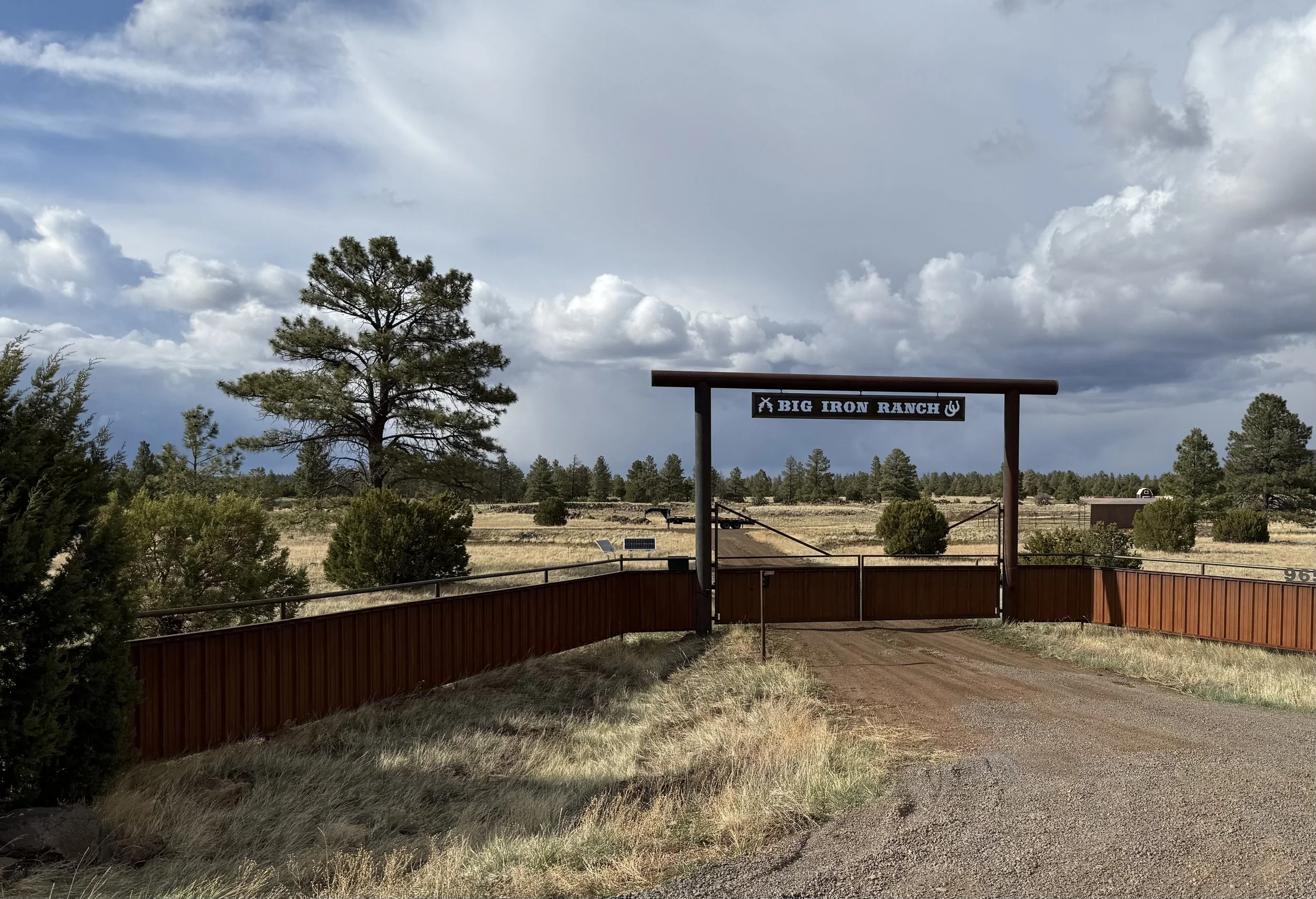 Entrance to Big Iron Ranch with a sign reading 'Big Iron Ranch'.