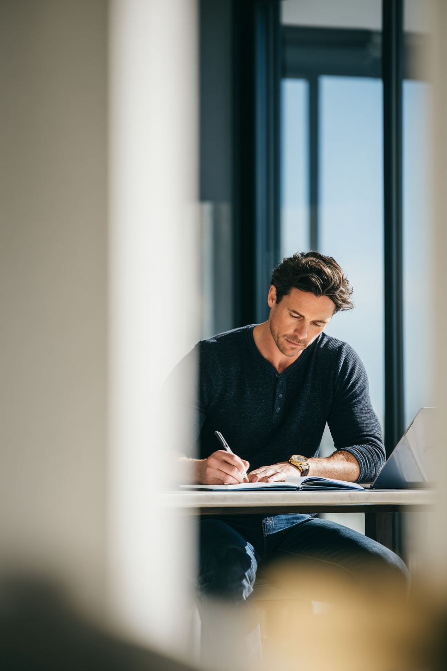 Business owner taking notes during operations planning session