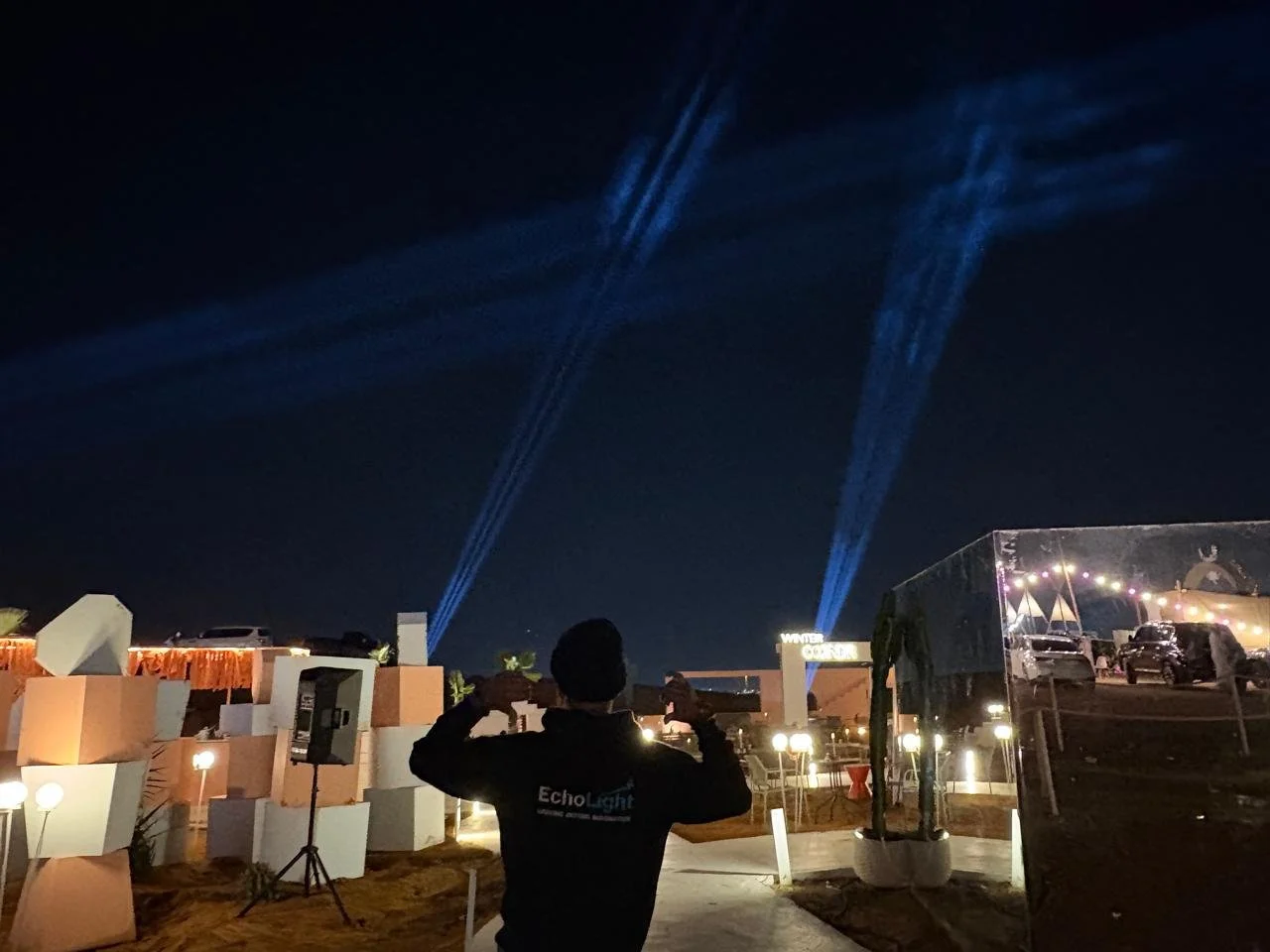 Advanced stage lighting setup by EchoLight showcasing a creative spiral beam arrangement to define moments and craft an immersive atmosphere