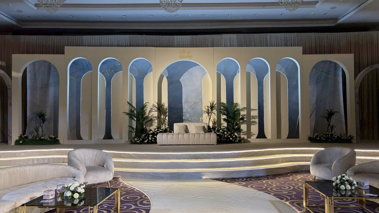 LED lit wedding steps and arches on a stage