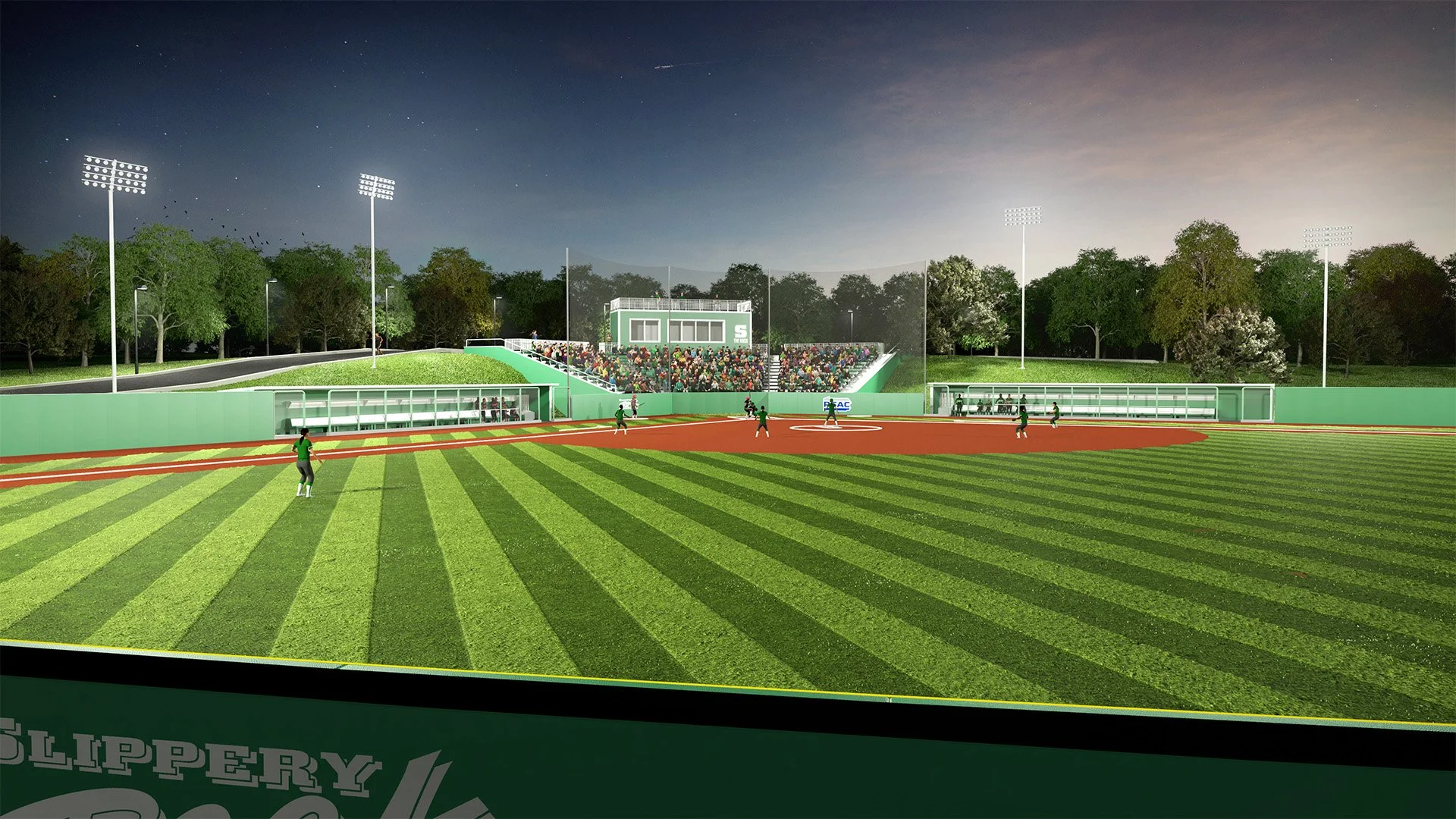 Night view of a baseball stadium with players on the field, spectators in the stands, and trees in the background.