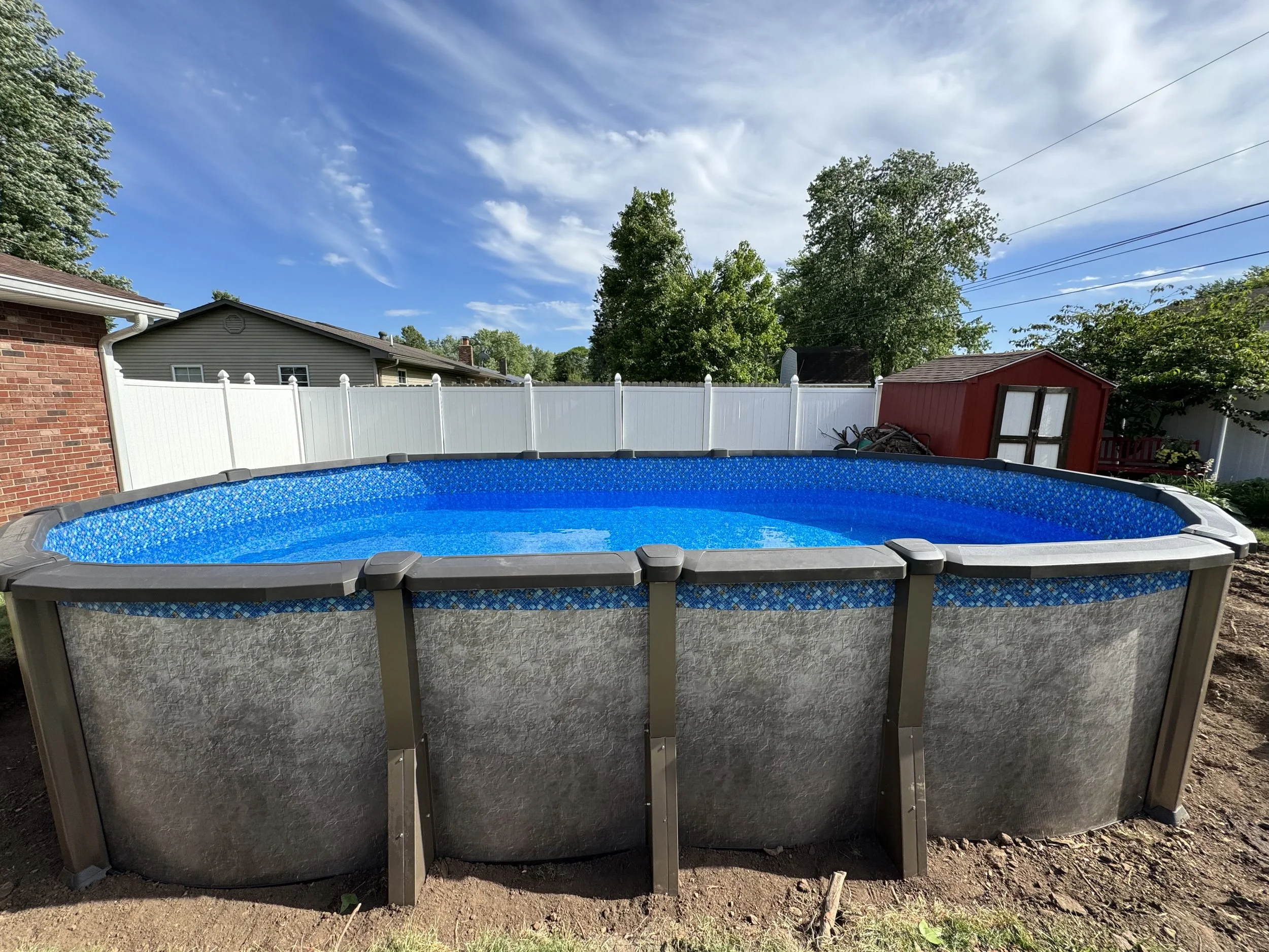 Above-ground pool installation by Wallace Pools and Hardscapes in Brazil Indiana