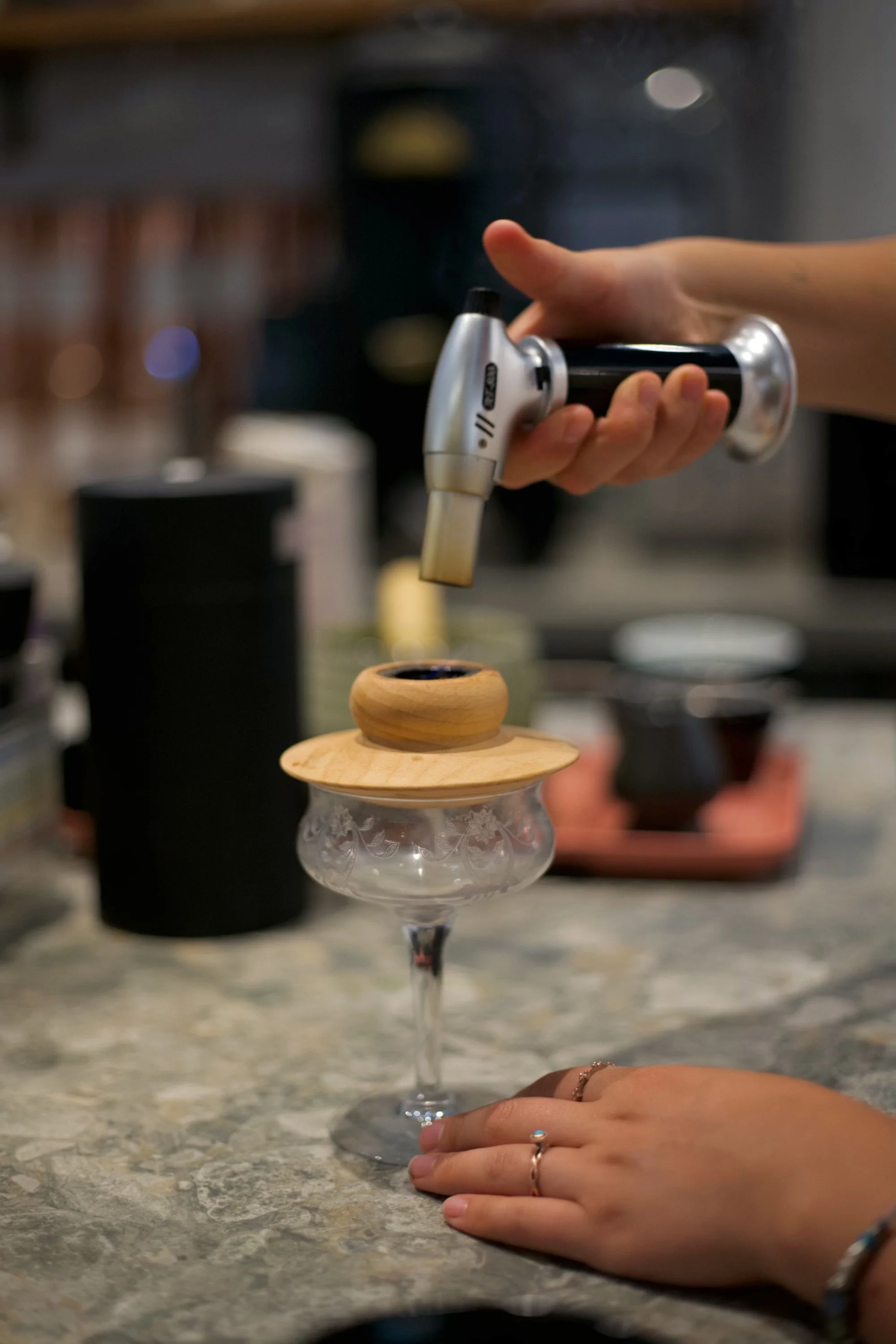 Preparing our signature beverage, The Smoking Gun