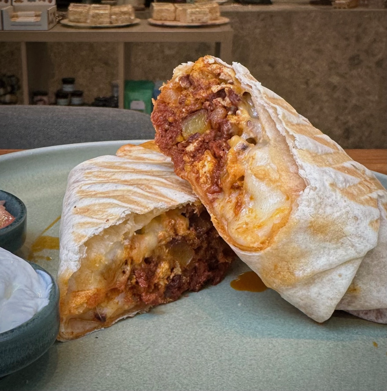 Close-up of a sliced chorizo breakfast burrito