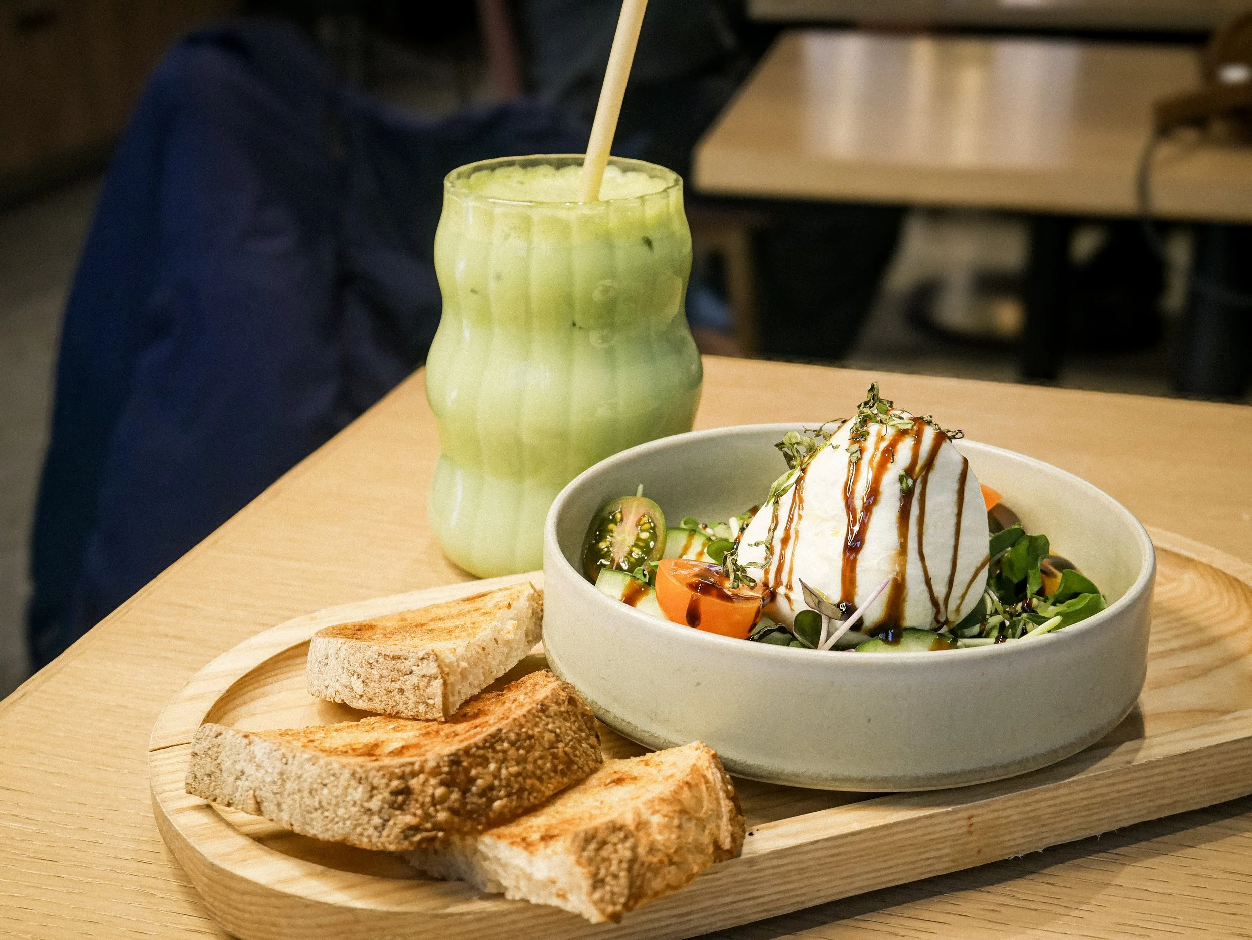 Deconstructed burrata toast with an iced matcha